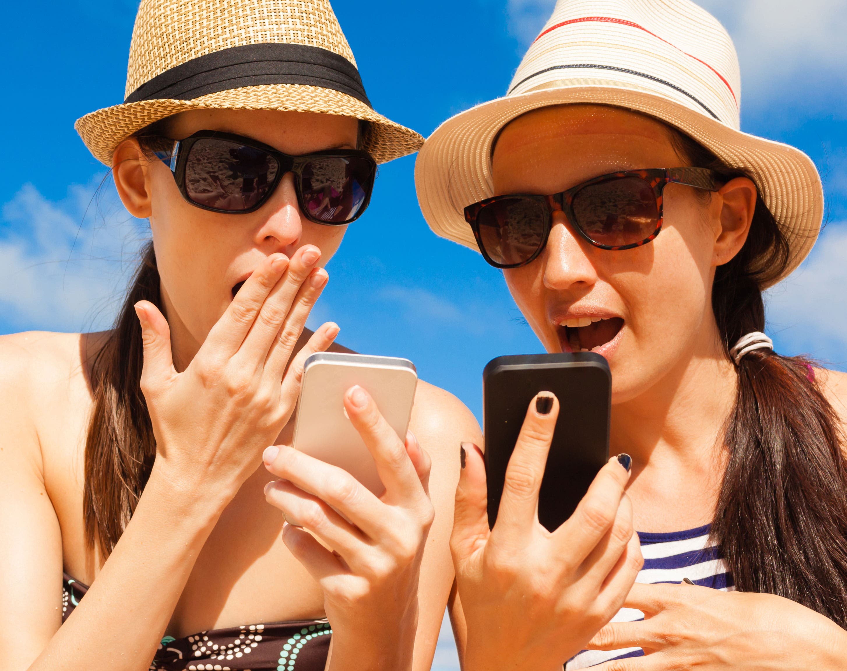 teenagers using iPhones
