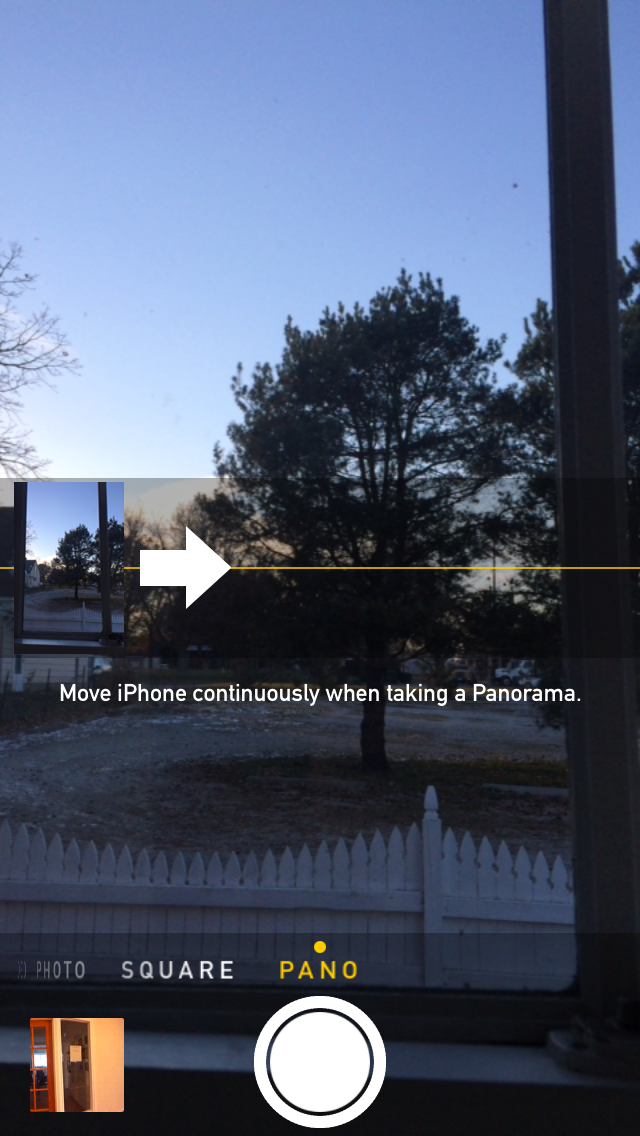 How do you take a panorama photo with an iPhone?