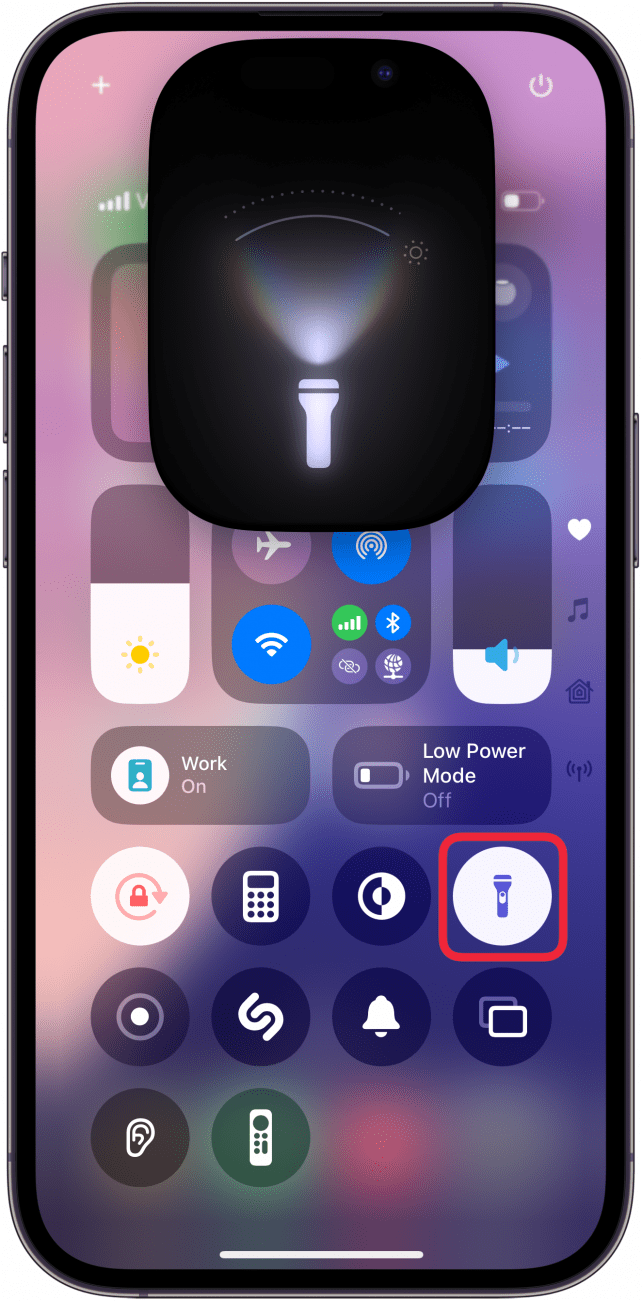 iphone control center displaying flashlight ui with a red box around flashlight icon