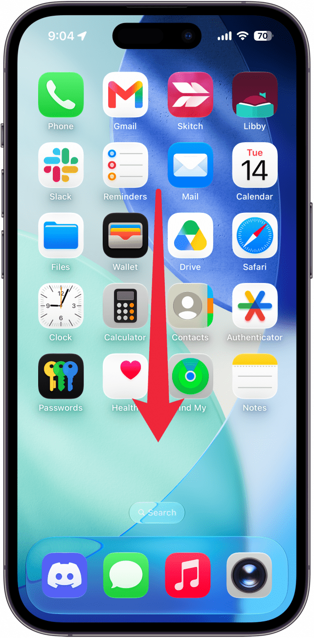 a screenshot of the iphone home screen with a red arrow pointing downward, indicating to swipe down