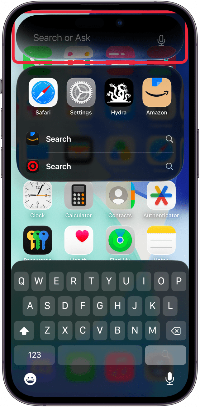 a screenshot of the iphone home screen displaying iphone search with a red box around the search box