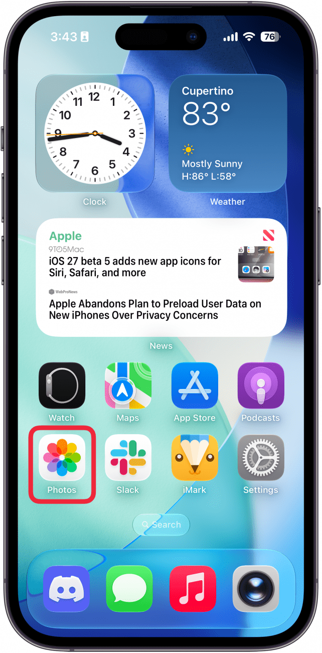 a screenshot of the iphone home screen with a red box around the photos app