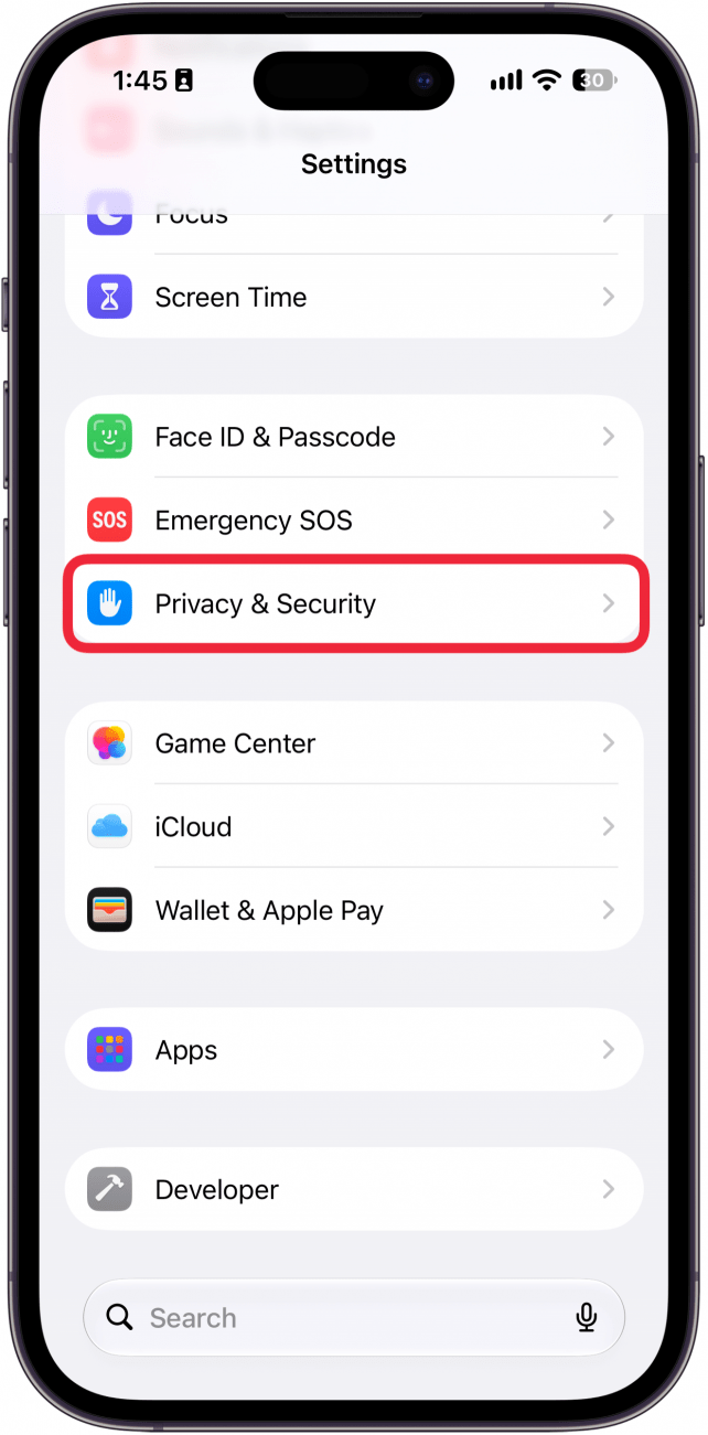 a screenshot of iphone settings app with a red box around privacy and security