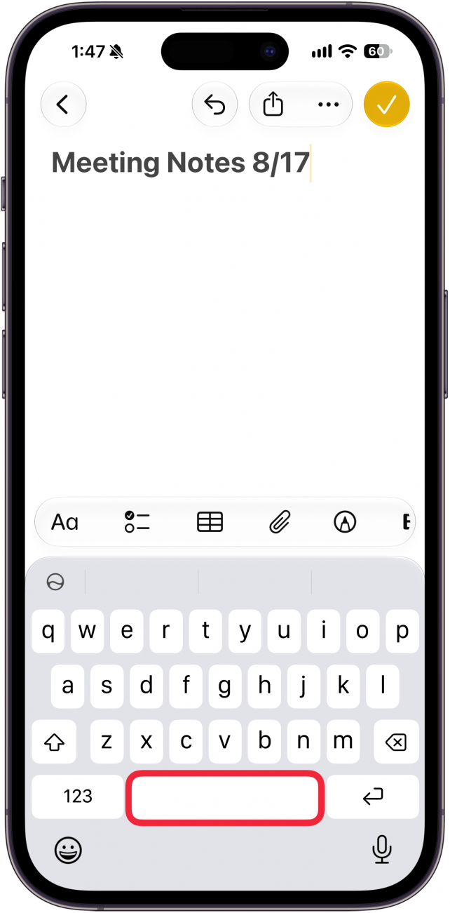 a screenshot of the notes app on iphone displaying the new note screen with a red box around the space bar on the keyboard