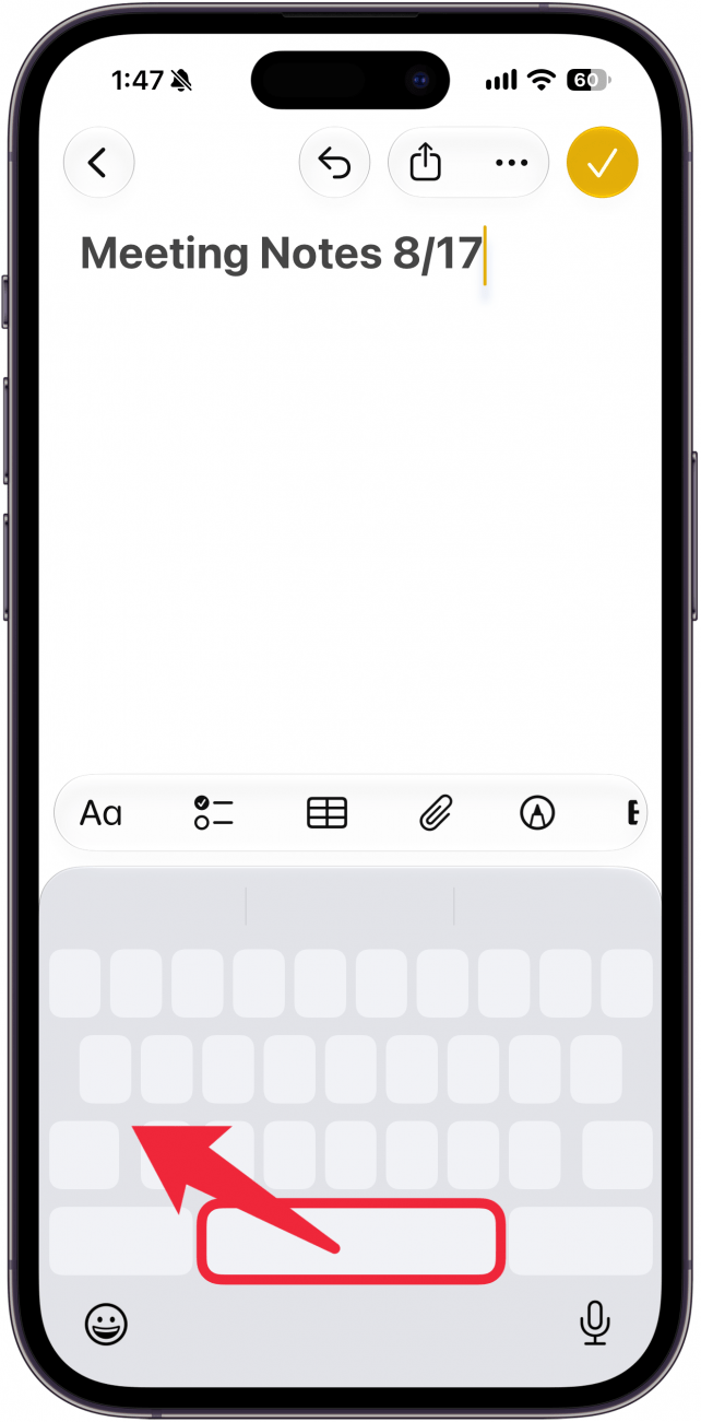 a screenshot of the notes app on iphone displaying the new note screen with a blank keyboard, there is a red box around the space bar and a red arrow pointing away