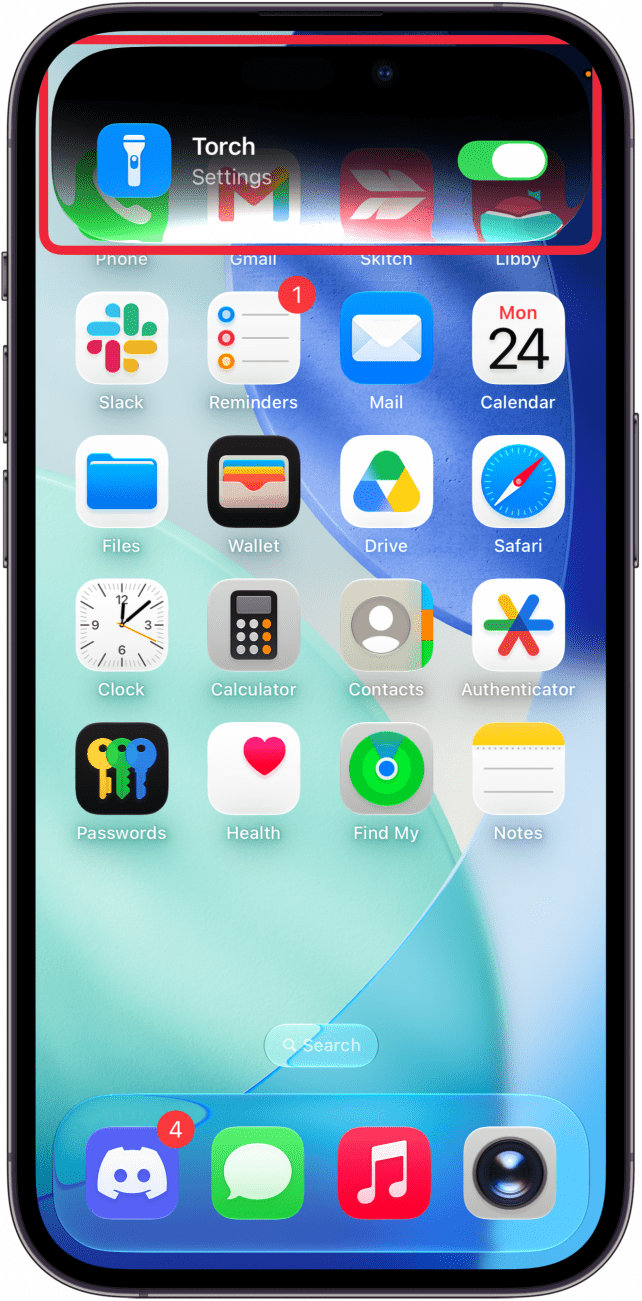 a screenshot of the iphone home screen displaying a siri toggle for the flashlight that is enabled