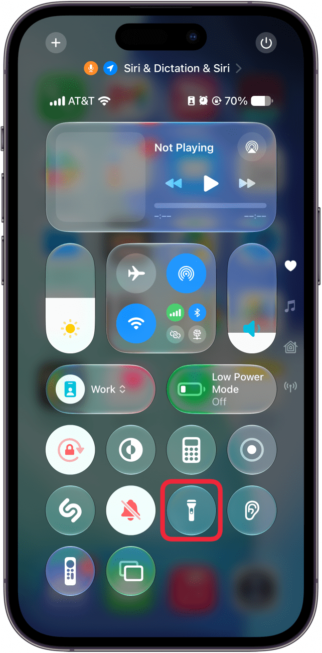 a screenshot of the iphone control center with a red box around flashlight icon, which is now gray