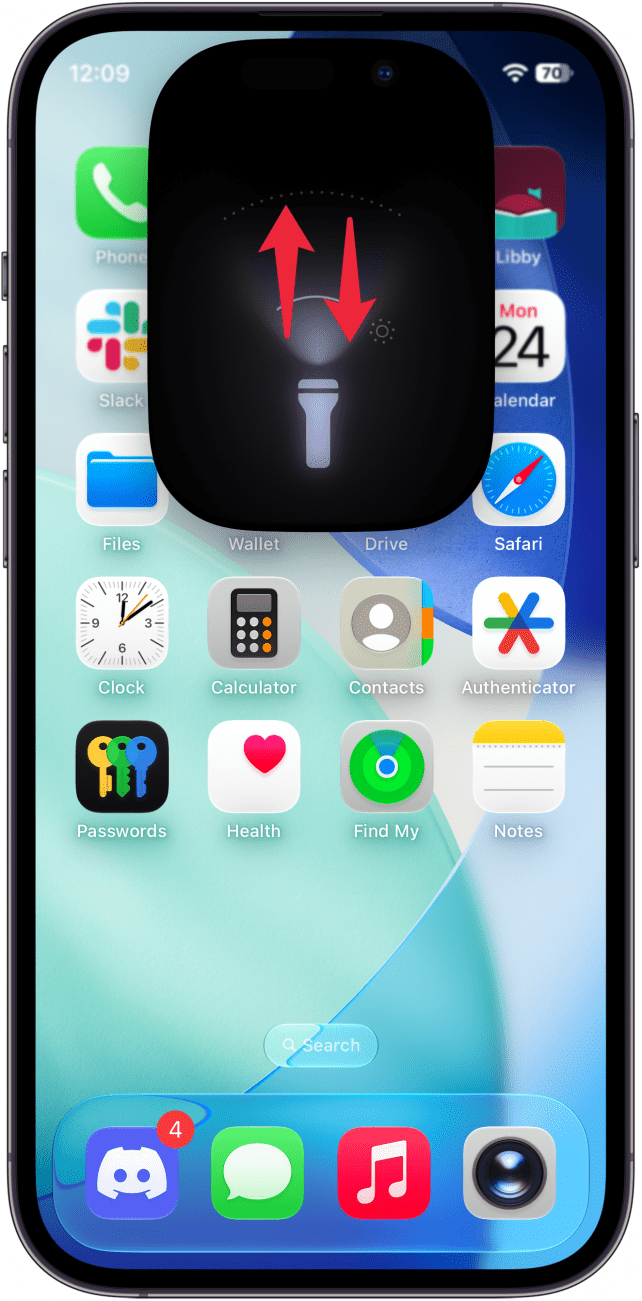 a screenshot of the iphone home screen displaying the flashlight UI and red arrows pointing up and down