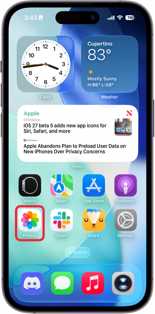 a screenshot of the iphone home screen with a red box around the photos app