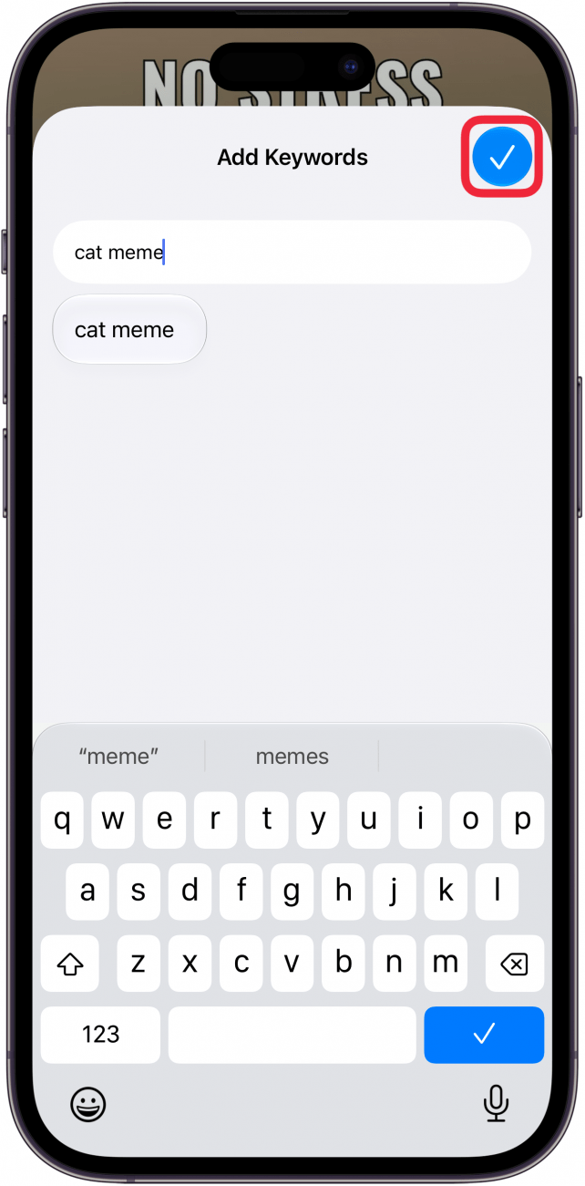 a screenshot of the add keywords screen in the photos app on iphone with a red box around the checkmark icon