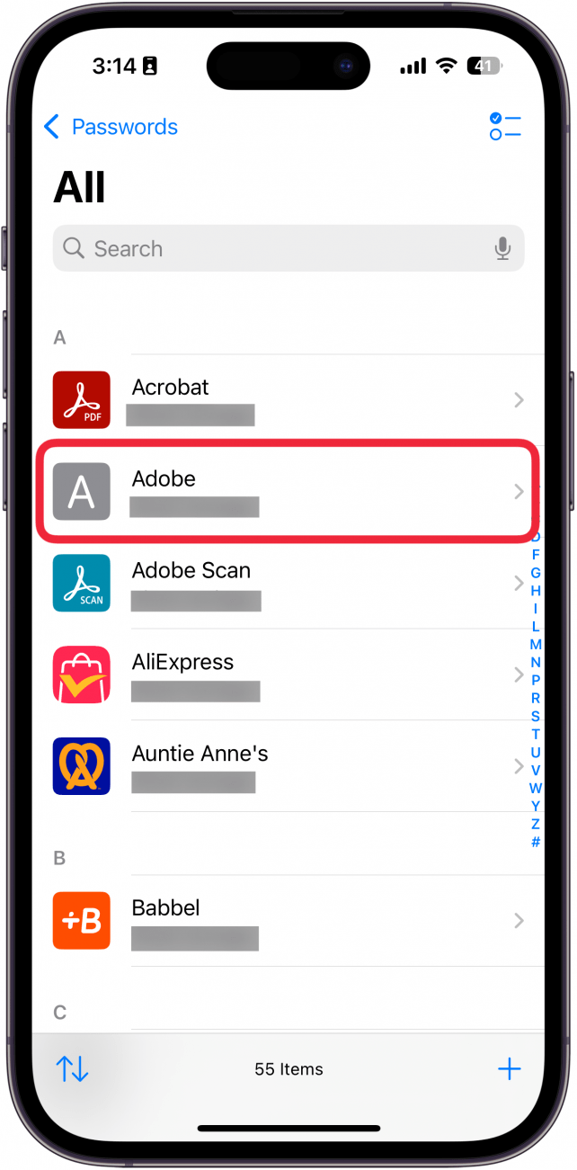 iphone passwords app displaying a list of passwords with a red box around adobe