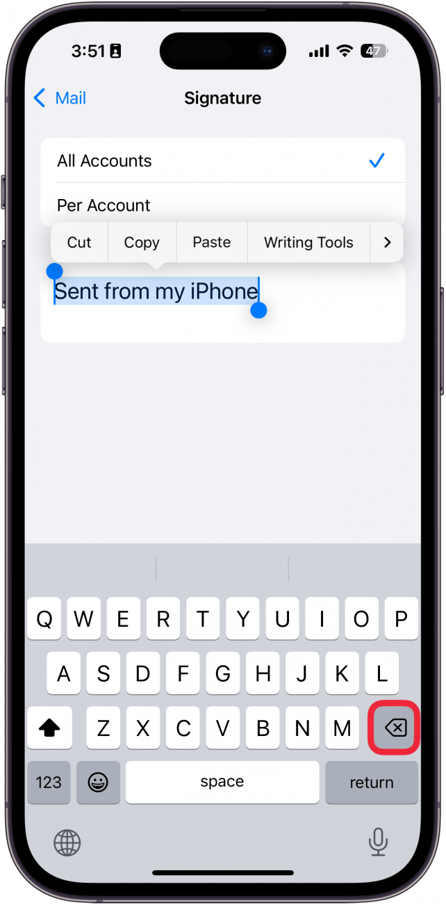 a screenshot of iphone email signature settings displaying the keyboard with a red box around the backspace key