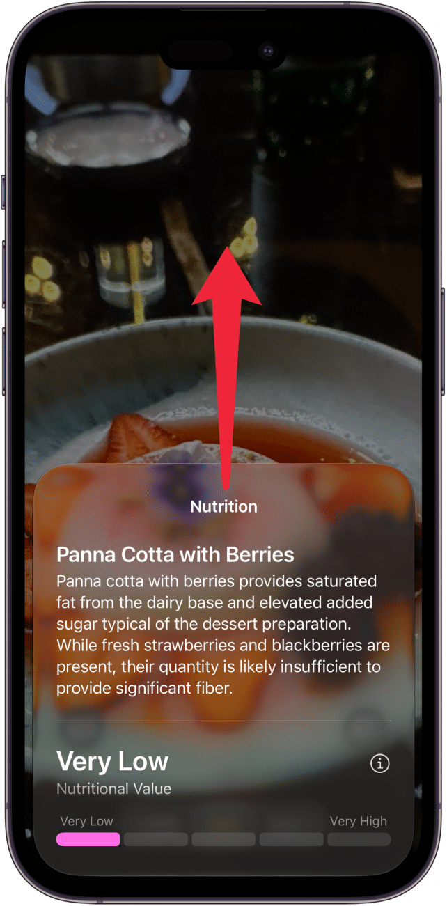 a screenshot of visual intelligence on iphone displaying nutrition information for a fruity dessert with a red arrow pointing upward, indicating to swipe up