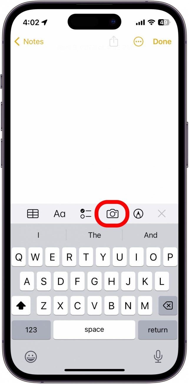 A Notes app screen with the camera icon circled in red.