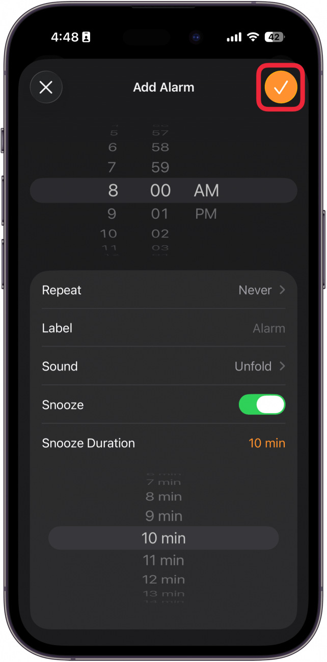 a screenshot of the iphone clock app's new alarm screen with a red box around the checkmark icon