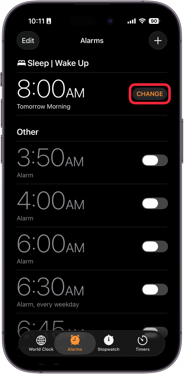 a screenshot of the iphone clock app with a red box around the change button next to the wake up alarm