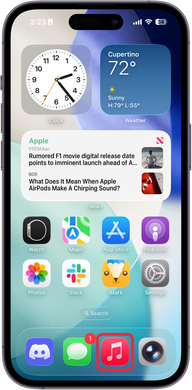 a screenshot of the iphone home screen with a red box around the music app