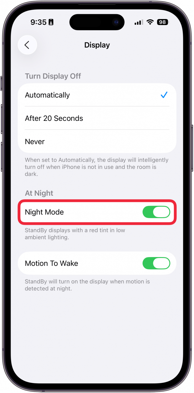 a screenshot of the iphone standby display settings with a red box around the night mode toggle