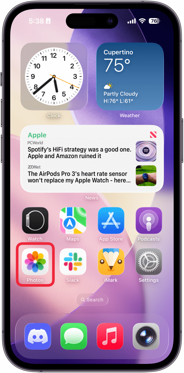 a screenshot of the iphone home screen with a red box around photos app