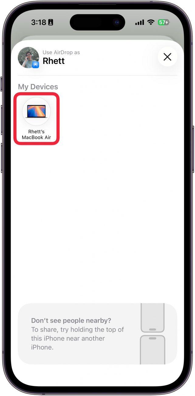 a screenshot of the airdrop screen on iphone with a red box around a macbook