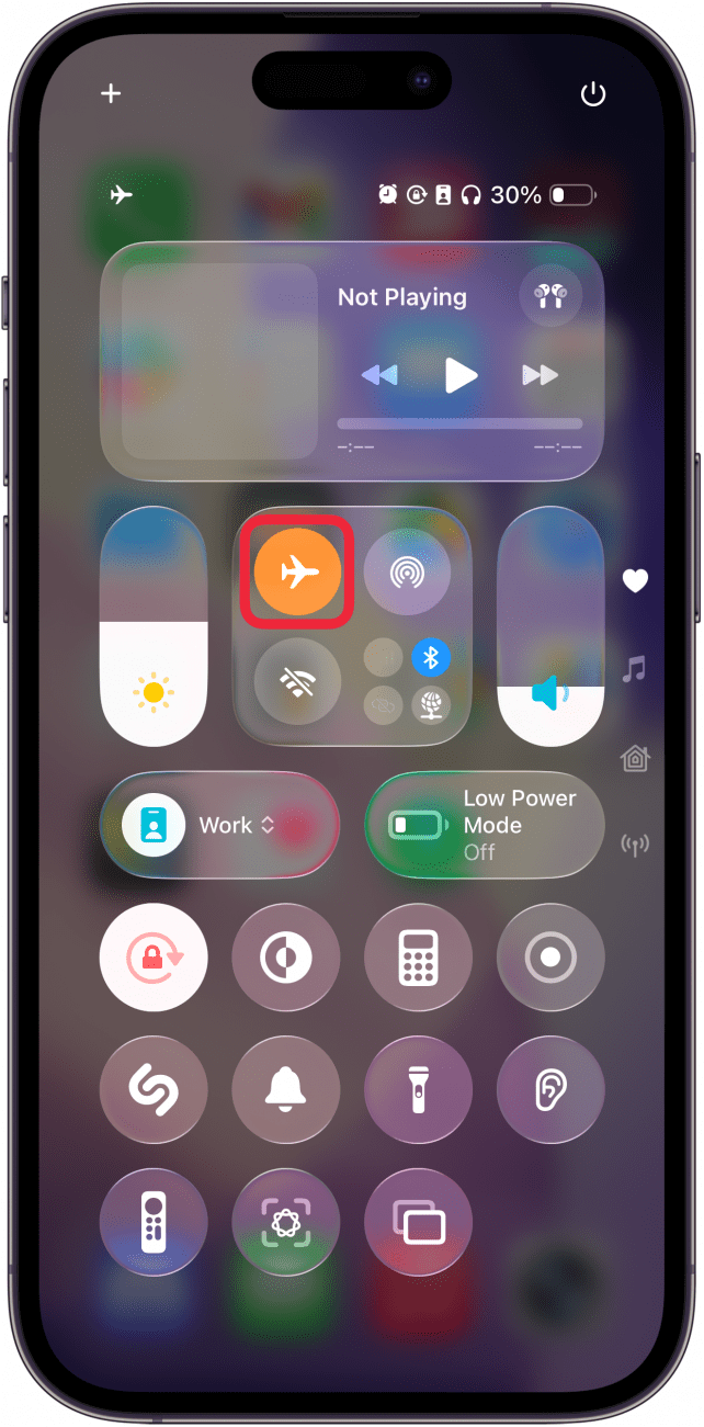 a screenshot of the iphone's control center with a red box around the airplane mode symbol which is orange, indicating that it is currently enabled
