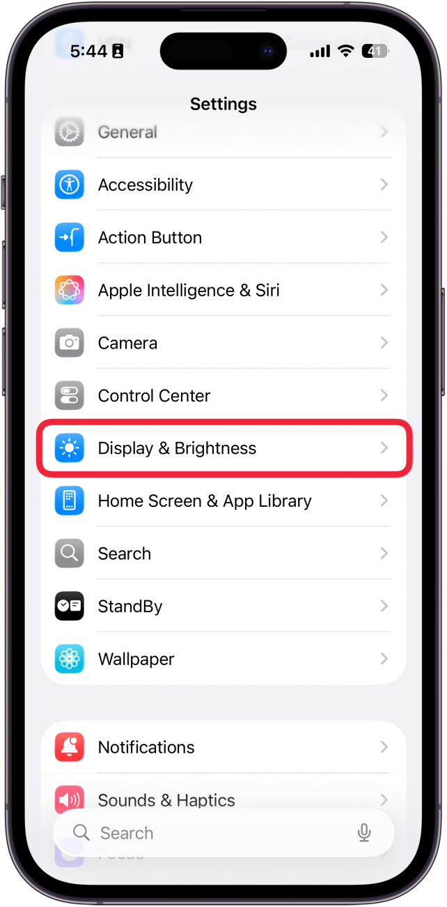 a screenshot of the settings app on iphone with a red box around display & brightness