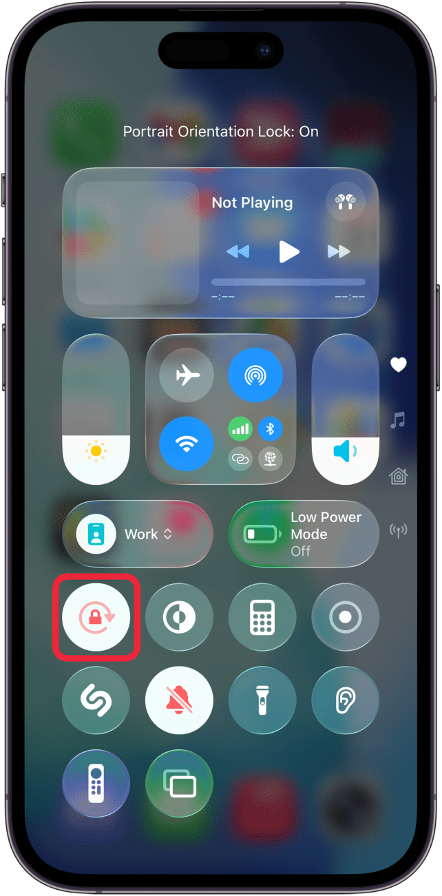 a screenshot of the iphone conrtol center with a red box around the white and red rotation lock icon with looks like a circular arrow with a padlock in the center