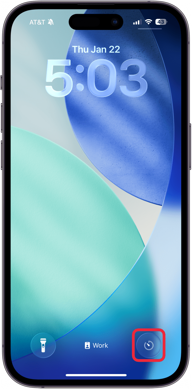 a screenshot of the iphone lock screen with a red box around the newly added timer shortcut in the lower right corner
