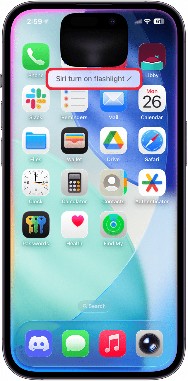 a screenshot of the iphone home screen displaying an active siri prompt that reads "turn the flashlight on"