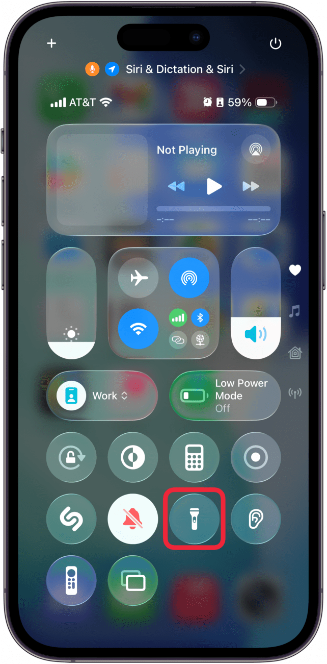 a screenshot of the iphone control center with a red box around flashlight icon, which is now gray