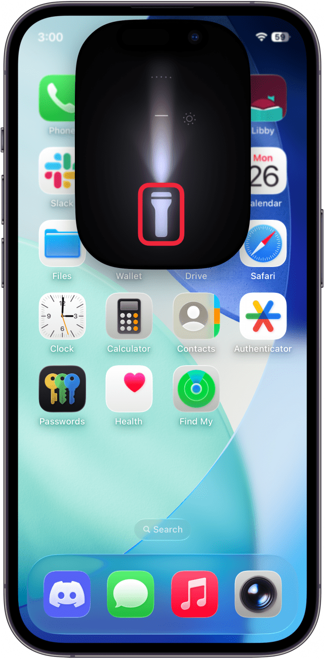 a screenshot of the iphone home screen displaying the flashlight UI and a red box around the flashlight icon