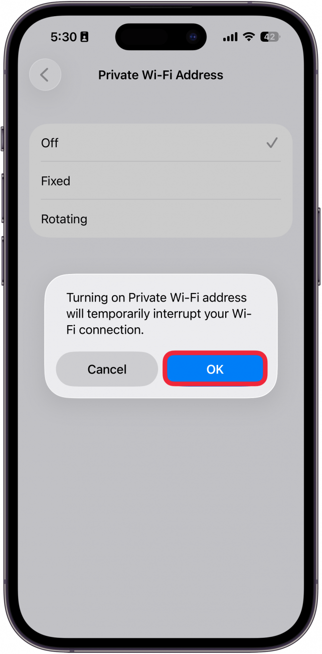 a screenshot of iphone wi-fi privacy settings displaying a pop up that the device will be disconnected from wi-fi for a moment with a red box around ok