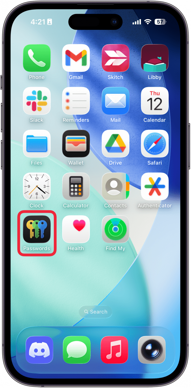 a screenshot of the iphone home screen with a red box around the passwords app