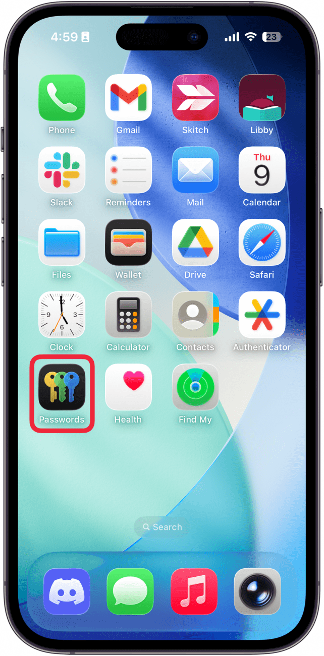 a screenshot of the iphone home screen with a red box around the passwords app