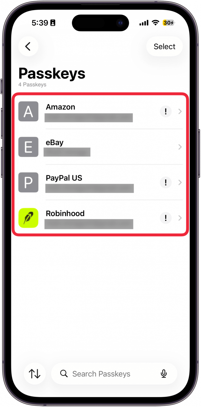 a screenshot of the iphone passwords app passkeys screen with a red box around a list of passkeys