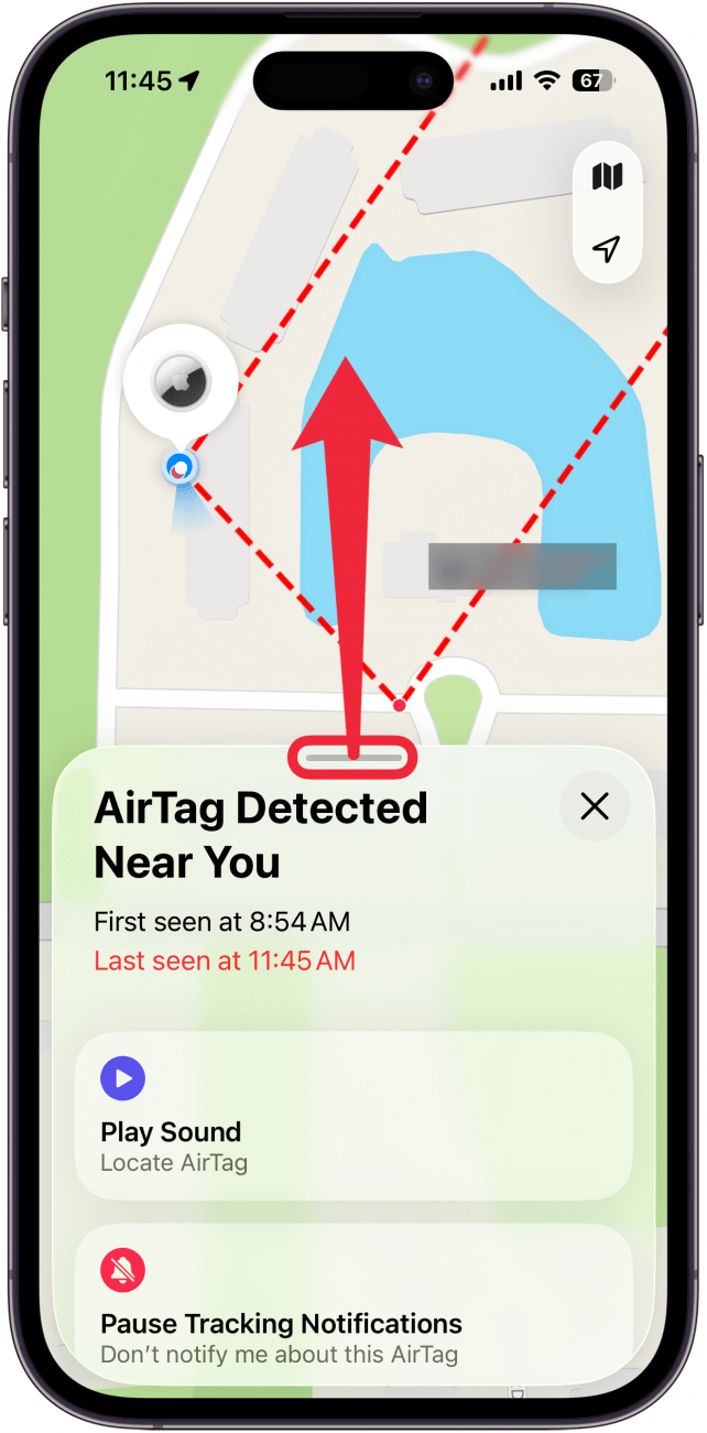 a screenshot of the find my app displaying a map of where the airtag was detected with extra options. there is a red arrow pointing upward indicating to swipe up