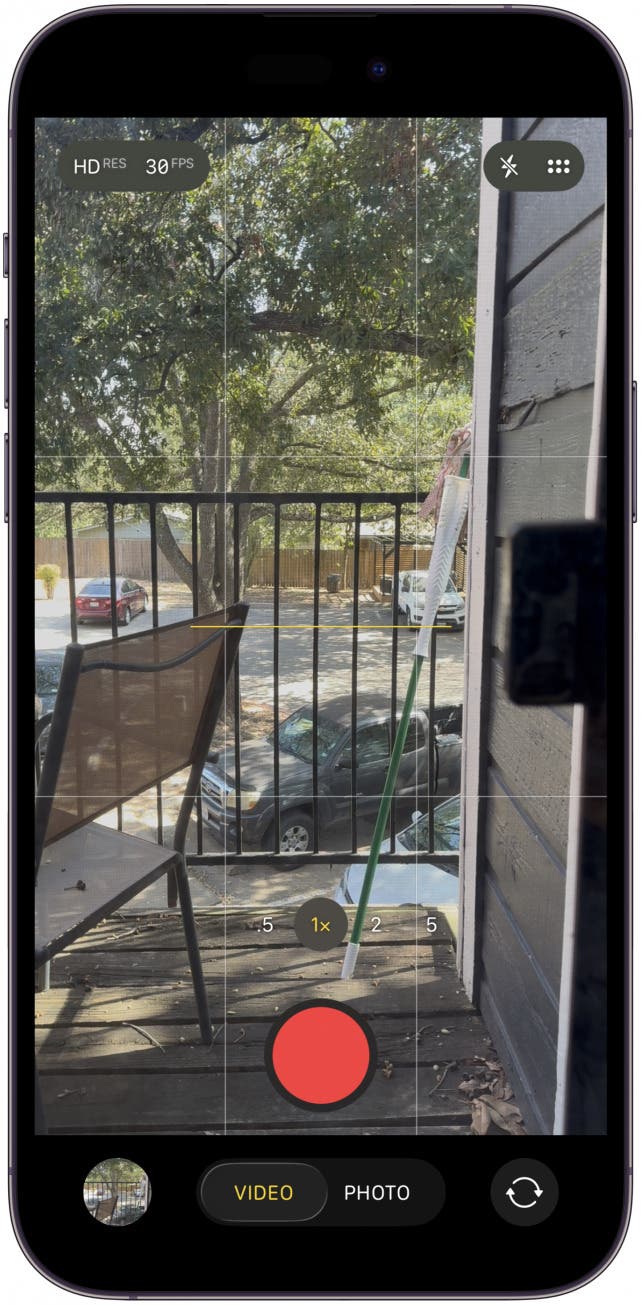 To take a video, make sure your Camera app is on video mode then press and hold the stem to record.