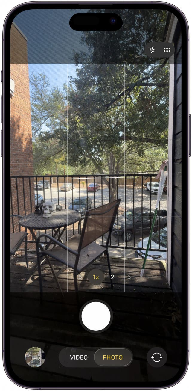To take a photo, make sure your Camera app is on photo mode then press and hold the stem and you may hear a feedback tone once the photo is taken.