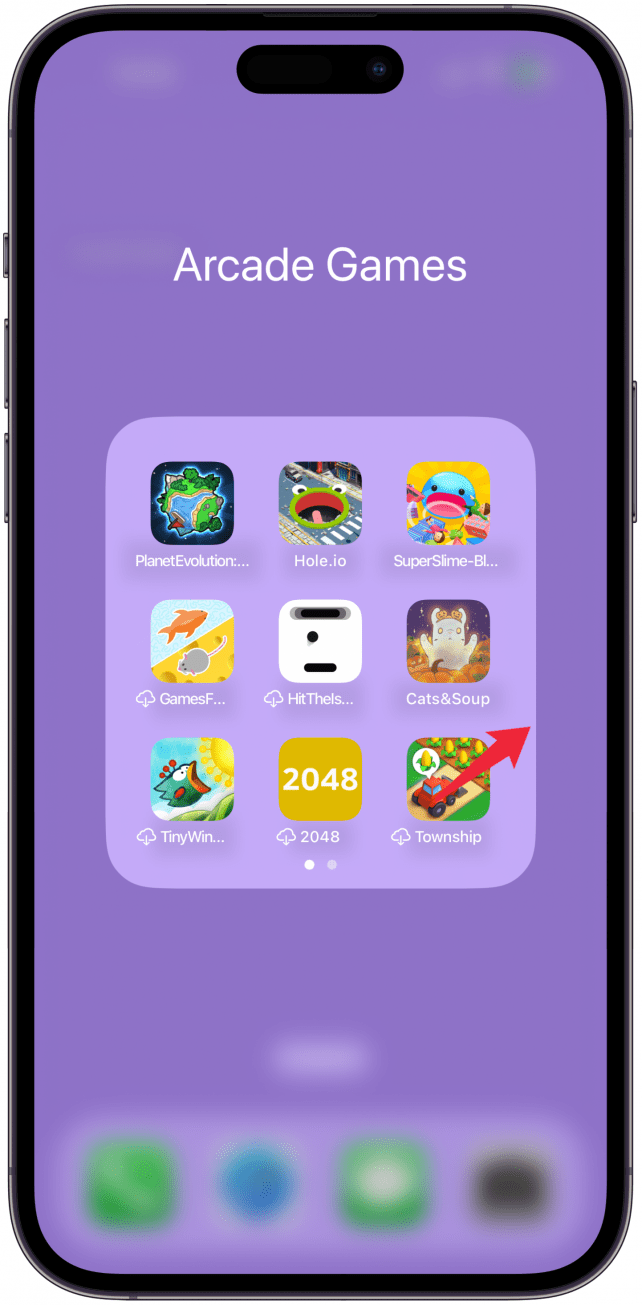 Tap to open the folder, then drag the app to the right so you can place it on the next page of the folder, you can even skip a page and have an entire empty page between your visible apps and your hidden app.