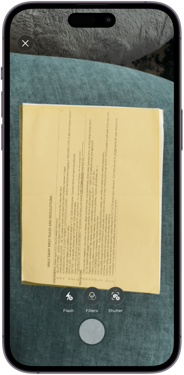 Position the document so that it is entirely in view and the camera will automatically take the photo.