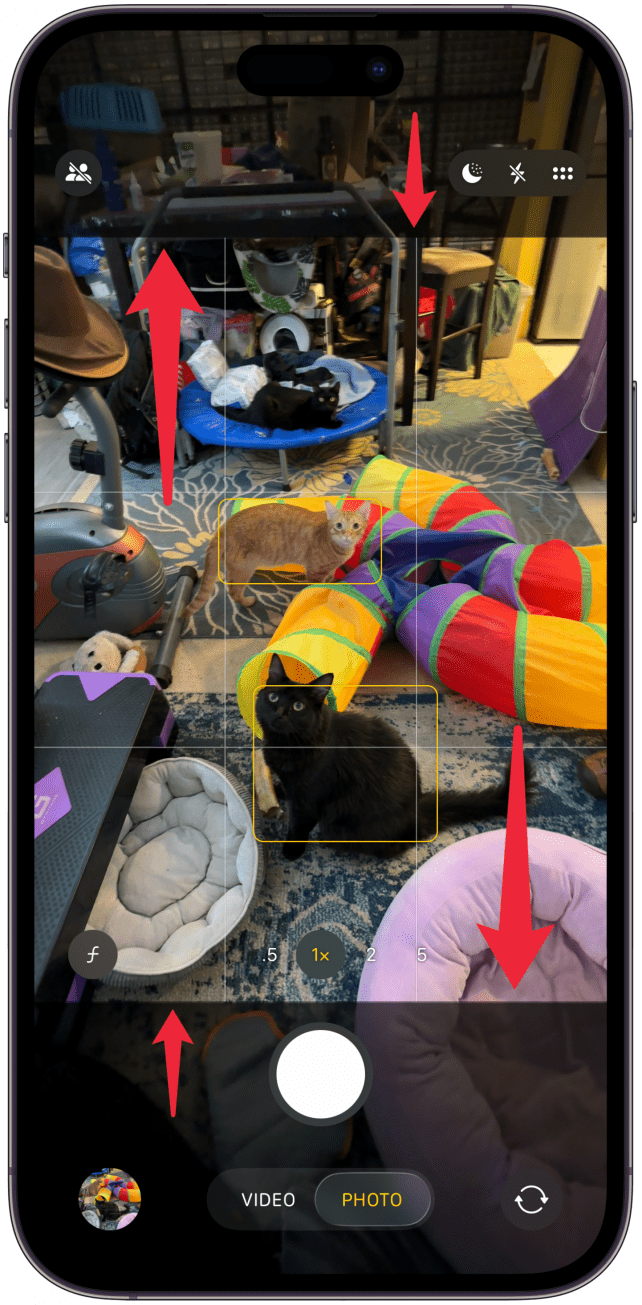 iphone camera app with red arrows pointing at the borders at edge of viewfinder