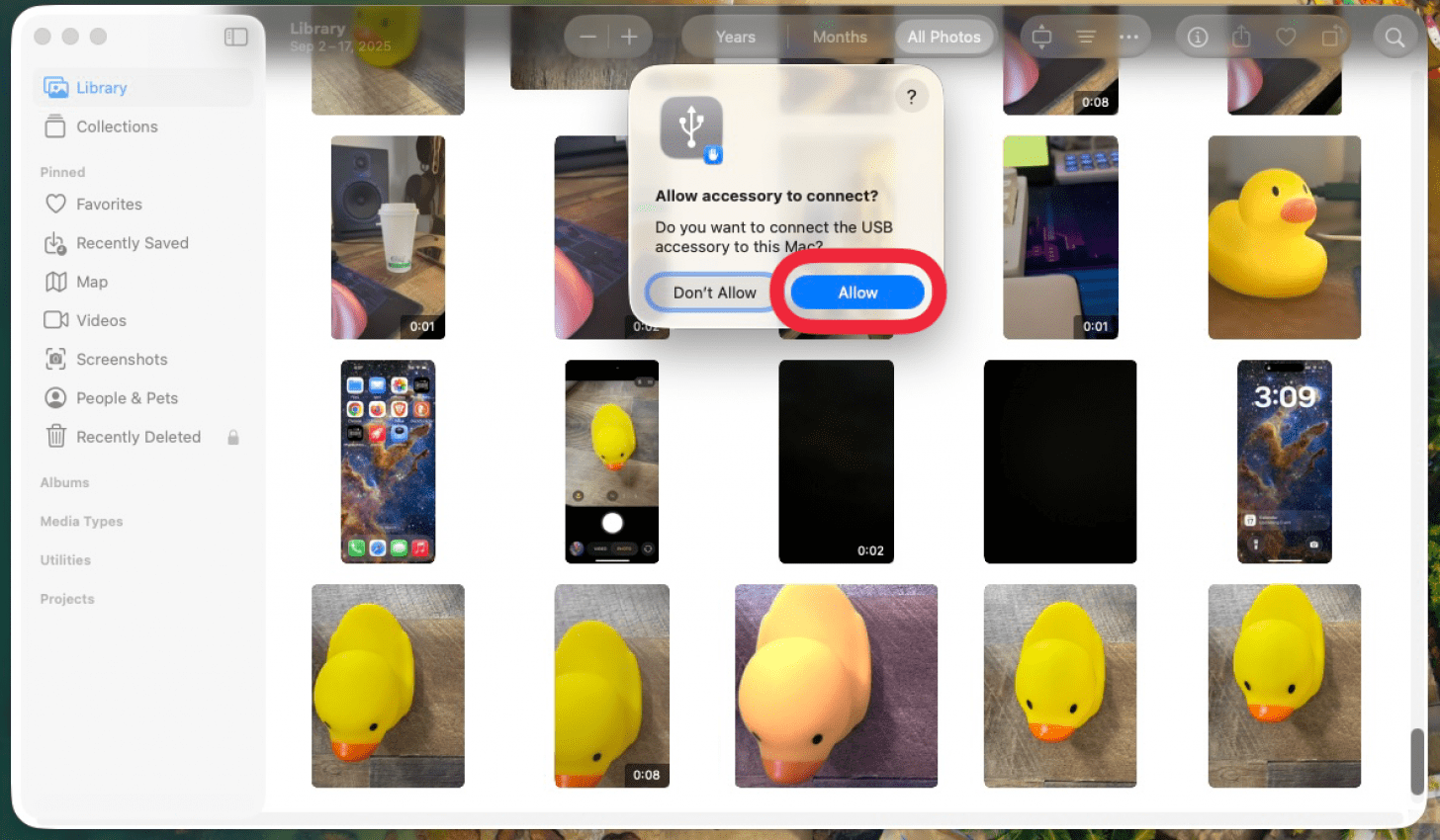 a screenshot of the photos app on mac displaying a pop up asking for the user to allow their iphone to connect with a red box around the allow button