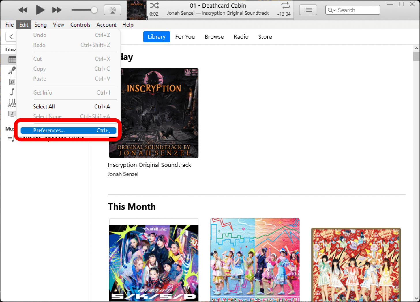 iTunes in the Library tab with the Edit menu open and the Preferences option marked.