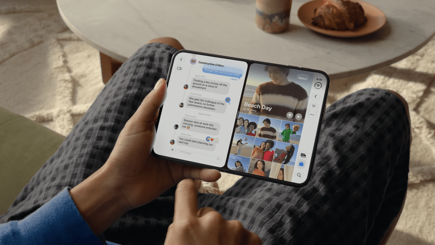 a pov image of a person holding an opened iphone duo which has two apps open side by side