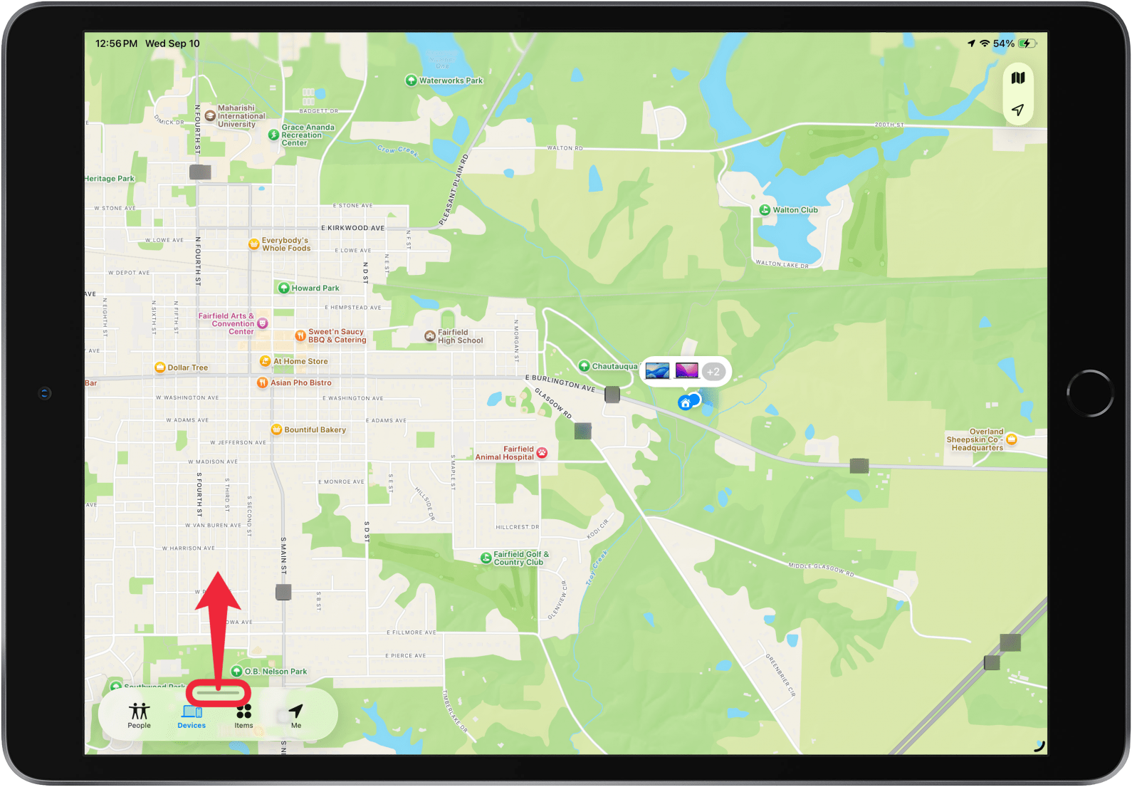 a screenshot of the find my app on ipad with a red box around the gray line in the device list and a red arrow pointing upward, indicating for the user to swipe up