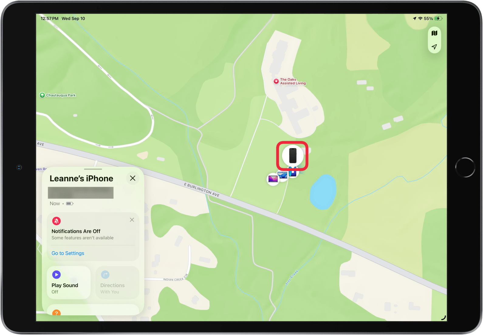 a screenshot of the find my app on ipad displaying device details showing a black iphone screen and red box around the iphone icon