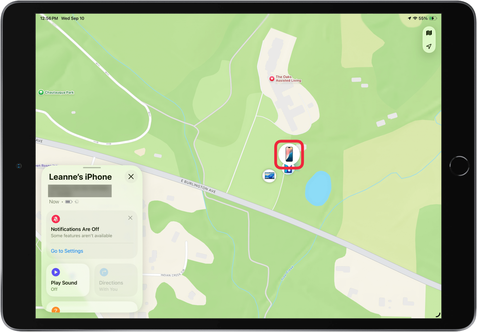 a screenshot of the find my app on ipad displaying device details showing a colorful iphone screen and red box around the iphone icon