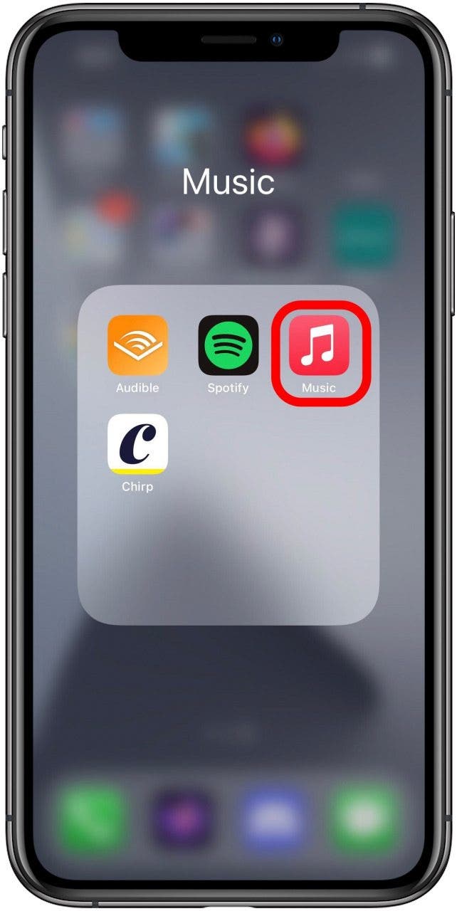 Home screen folder open with the Music app marked.