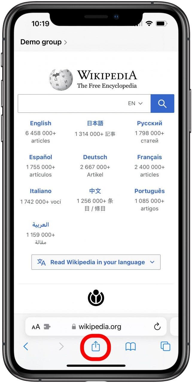 Safari with the Wikipedia main page open in a Group tab and the share button marked.
