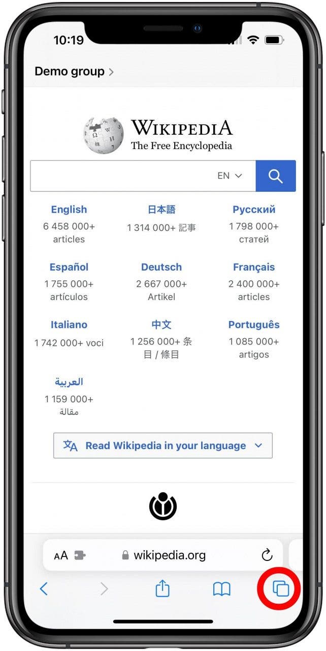 Safari with the Wikipedia main page open in a Group tab and the tabs button marked.